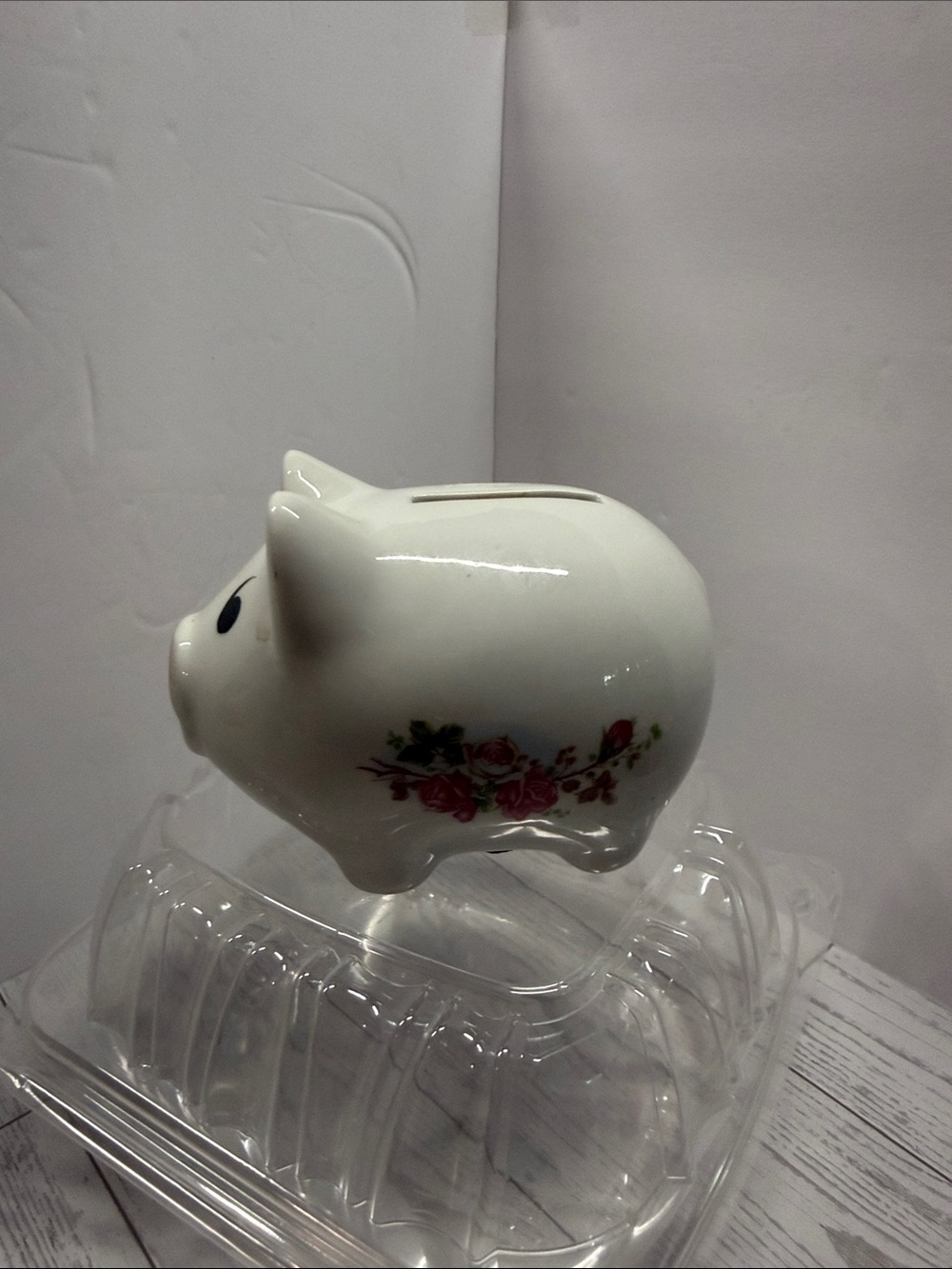 Ceramic piggy bank. With pink roses.